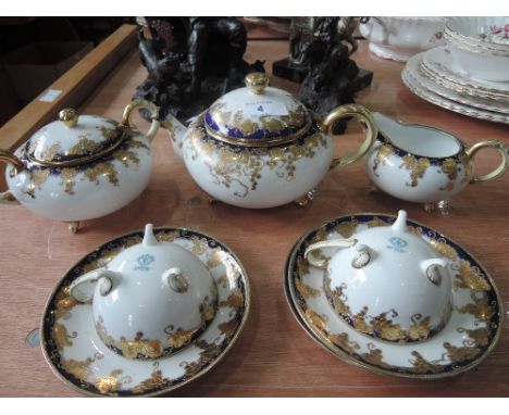 A Noritake tea set, and two cups and saucers, blue and gilt on a white ground