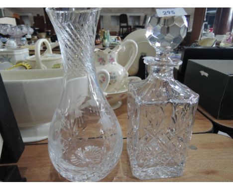 An etched glass vase and cut glass decanter