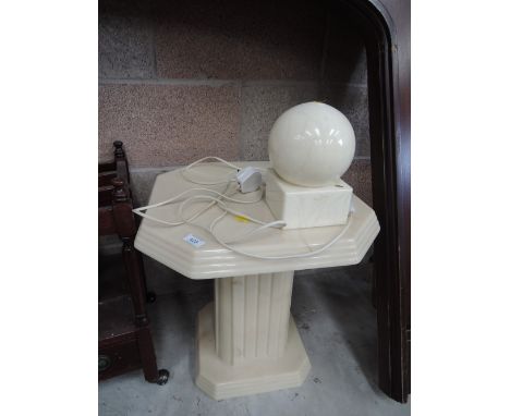 A vintage marble effect occasional table and lamp