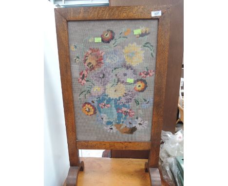 An early 20th Century oak framed tapestry firescreen