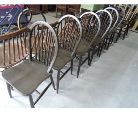 A set of 8 (6 plus 2) traditional dark stained hoop and stick back dining chairs