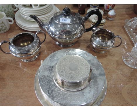 A plated tea service and place matts