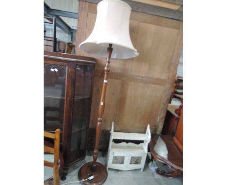 A mahogany standard lamp