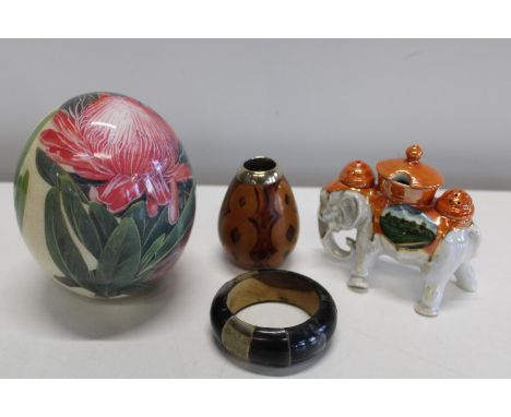 A hand painted ostrich egg &amp; ceramic elephant condiment set 