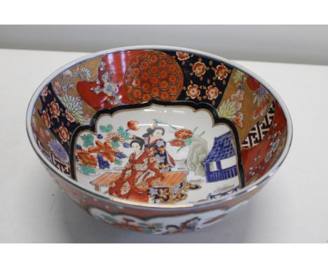 A large ceramic Oriental footed bowl with marks to base25.5cm dia 