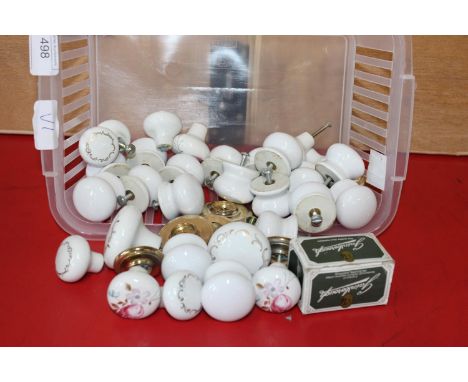 A basket of vintage ceramic door knobs 