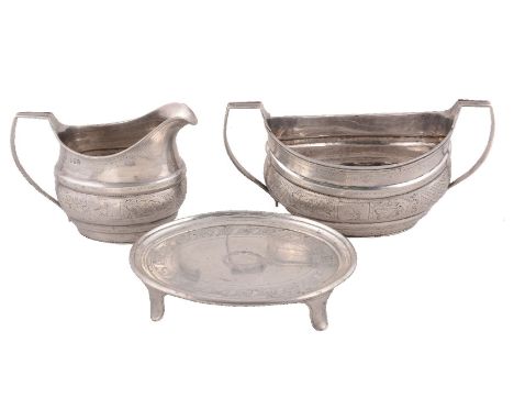 A George III Irish silver tea pot stand, sugar basin and milk jug by Robert Breading, Dublin 1805, oval moulded baluster, pri