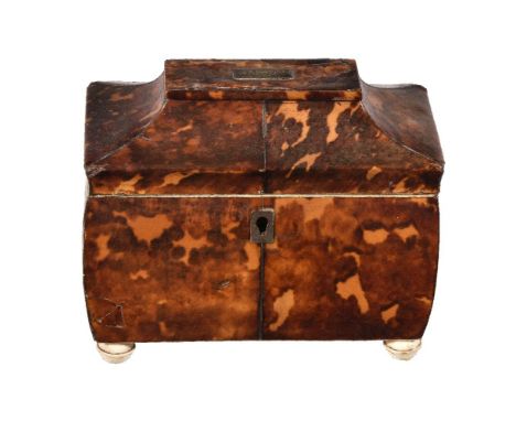 ϒA George III tortoiseshell veneered, ivory mounted and metal strung tea caddy, circa 1800, of rectangular form, the hinged p