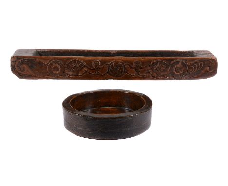 A turned and stained treen vessel or cheese mould, probably 18th century, possibly elm, of circular section, with incised lin