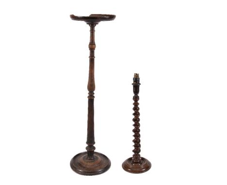 A George III turned, carved and stained walnut candle stand or torchère, third quarter 18th century, the moulded circular top