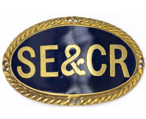 South Eastern &amp; Chatham Railway cap badge. SE&amp;CR inset in blue enamel on gilded brass, back marked with makers name J
