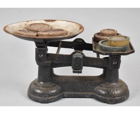 A Set of Vintage Cast Iron Kitchen Scales with Unrelated Weights 