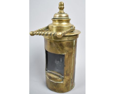 A 19th Century Marine Brass Cylindrical Lantern with Hinged Glazed Door and Barley Twist Carry Handle, Original Weighted Burn