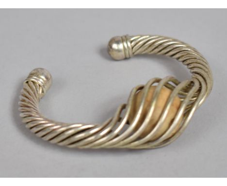 A White Metal Bangle, with Caged Ball 