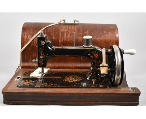 A Cased Manual Sewing Machine with Floral Enamelled Decoration 