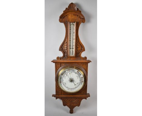 A Late Victorian Oak Wall Hanging Aneroid Barometer with Thermometer, 82cm high 