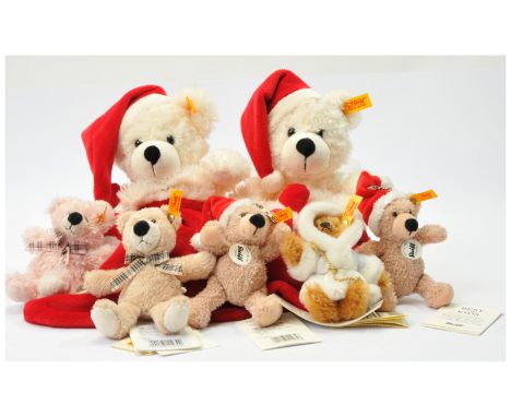 Steiff keyring and stocking group including: (1) &amp; (2) Cosy Christmas stocking, yellow tag 111525, red and white plush, s