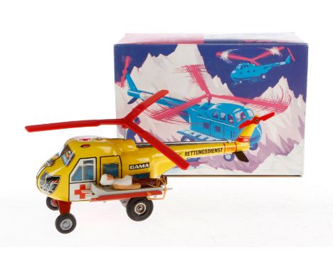 Gama Helikopter 2004, Blech/Kunststoff, Friktion, mit Figur und Bahre, Alterungsspuren, L 21, im tw besch. Karton, Z 2