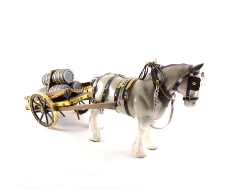 A Melba Ware horse and cart model, overall length 49cm; a Melrose Pottery horse and cart; another pottery horse and cart; and