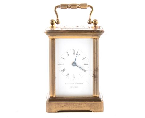 A small French carriage clock, white enamelled dial, signed Matthew Norman, London, platform escapement, 9.5cm.