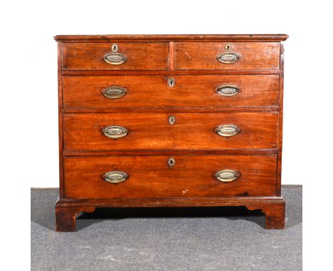 A joined oak chest of drawers, rectangular top, two short, three long graduating drawers, bracket feet, width 100cm, depth 50