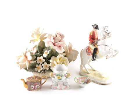 A Continental porcelain equestrian figure, Hofreitschule Wien, 30cm; a pair of Royal Worcester plates, after Audubon, Birds o
