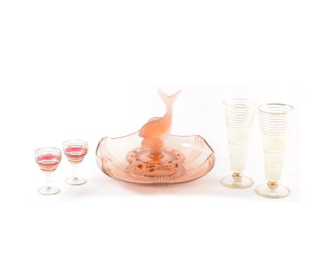 A pink glass table centre piece with removeable fish sculpture, 23cm high, 29.5cm diameter, pink glass decanter and glasses, 