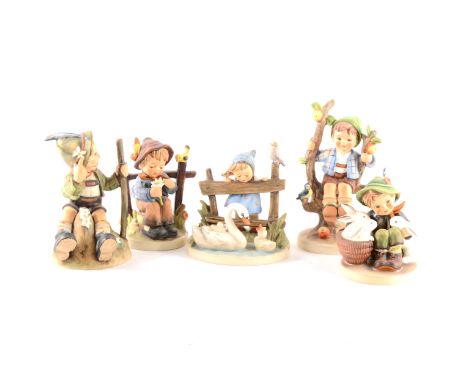 A collection of Hummel figurines, including Apple Tree, Boy and Girl, 16cm. (21)
