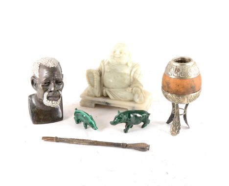 A figure of a reclining buddha carved in jade, 14cm, a Gaucho Gourd and pipe, two small pigs carved from malachite, and a fig