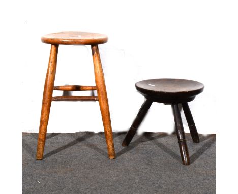 Old oak peg-leg stool with dished circular seat, on three turned and splayed legs, diameter 32cm; and an elm and beech Windso