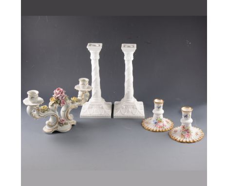A pair of Royal Worcester plain white candlesticks, No.1050, 28cm; a pair of Hammersely dwarf candlesticks; another pair of c