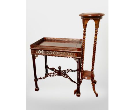 A reproduction carved mahogany occasional table in the Chinese Chippendale style, together with a jardiniere stand CONDITION 