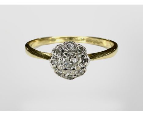 An 18ct gold diamond cluster ring. CONDITION REPORT: 2.1g.