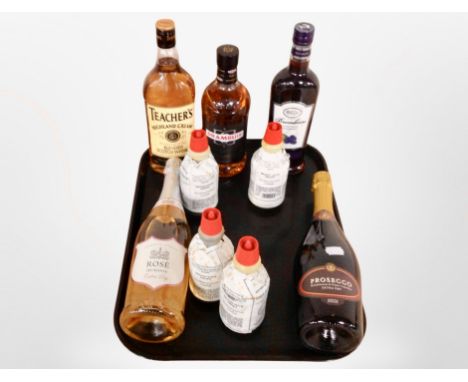 A group of alcohols including Teacher's Scotch Whisky, Drambuie, Prosecco, etc.
