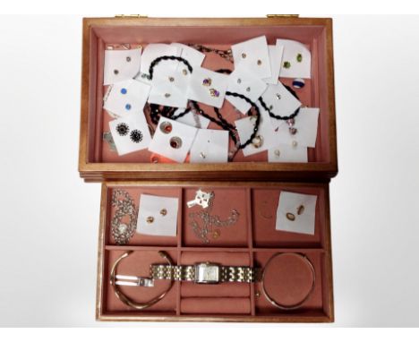 A contemporary jewellery box containing engraved silver bangle, numerous pair of earrings, ladies' Timex wristwatch.