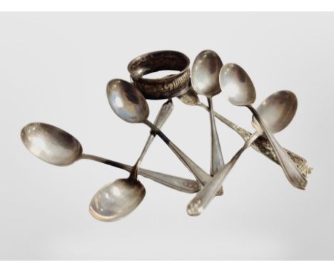 A set of six silver teaspoons, a further continental silver spoon, and a napkin ring. CONDITION REPORT: 75.6g gross.