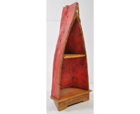 A 20th century Balinese canoe / boat plant stand shelving unit. Up cycled marine salvage with worn red paint to outside and i