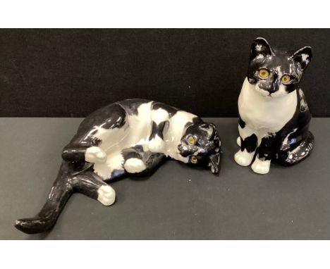 Winstanley black and white tabby cat, signed to base, 29cm high, another recumbent tabby, signed to base, 43cm long