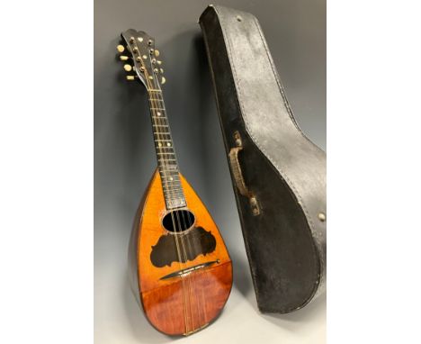 A Neapolitan mandolin, mother of pearl fret markers, bone string pegs, 61cm long, cased