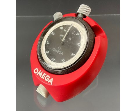 Omega; a mid 20th century metal cased stopwatch, the black and silver dial Arabic numerals subsidiary seconds, signed in grey