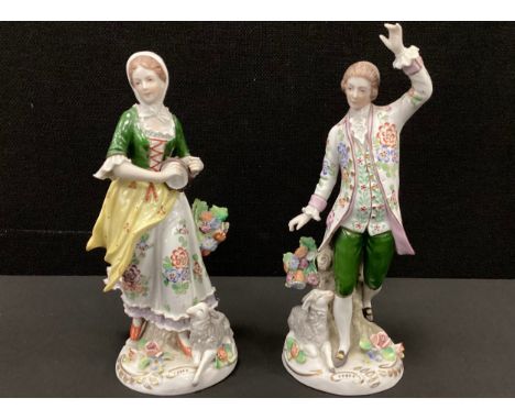 A pair of German porcelain figures, Shepherd and Shepherdess, both with Sitzendorf marks, 21cm high and 19cm high (2)