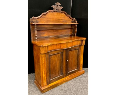 A late Victorian mahogany Chiffonier, carved cresting to the quarter galleried top, above a single shelf, and base with serpe