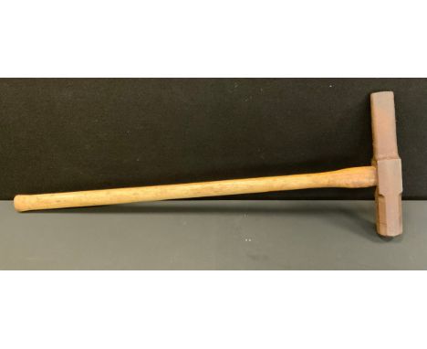 A large railway railing or punching hammer, cast iron head with tapering and sledge hammer sides, approx 33cm long, wooden ha