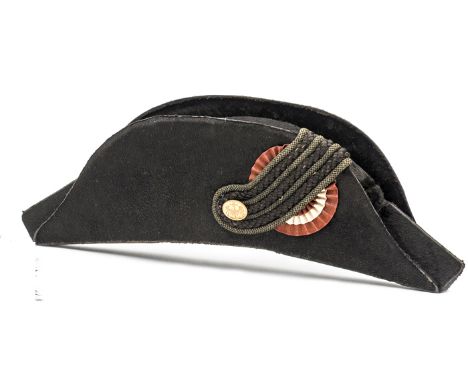 An Imperial German officer’s bicorn hat,  black beaver body, triple corded lace loop on red/white/red  rosette, gilt button b