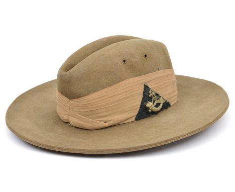 A WWII officer’s heavy khaki felt slouch hat of The 10th Gurkhas silk puggaree with WM badge on black cloth triangle, leather