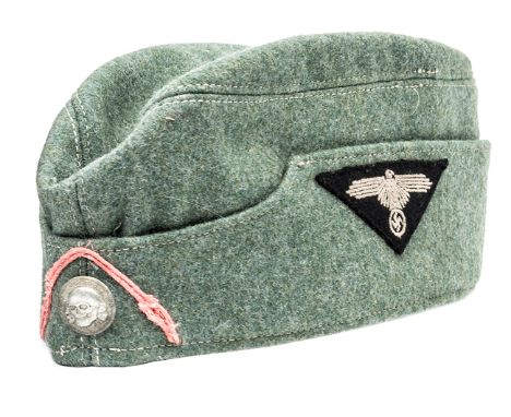 A Waffen SS mans 1st Pattern “Army style” forage cap,  field grey serge material with machine sewn eagle and swastika insigni