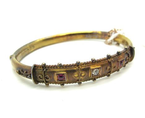A 15ct Gold Diamond Set Bangle, with inset highlights, hinged to snap clasp, Birmingham 1904 (internal diameter 5.6cm).