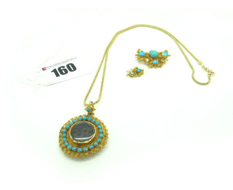 A XIX Century Style Circular Locket Pendant, with claw set highlights, the central glazed panel enclosing hairwork, on a mode