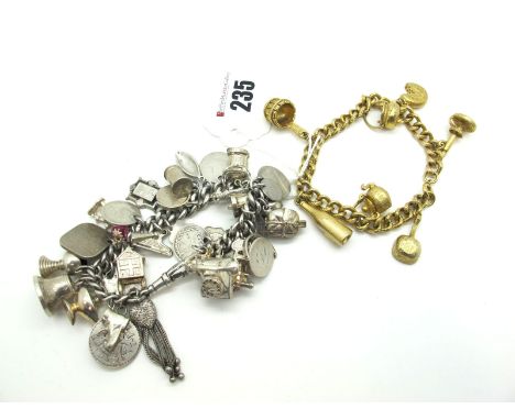 A Curb Link Charm Bracelet, to single swivel style clasp, suspending numerous assorted novelty harm pendants, including a tel