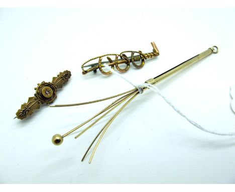 A 9ct Gold Swizzle Stick, telescopic, engine turned (open length 12cm); A Bar Brooch, as three horseshoes and a riding crop (